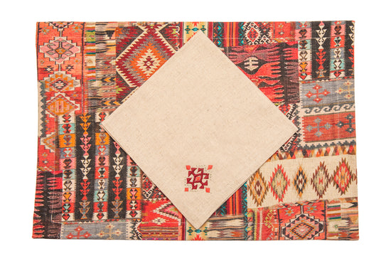 Red printed linen placemats with cream napkins.