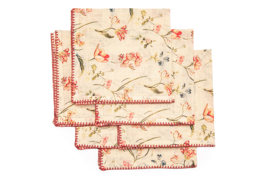 White linen floral printed dinner napkins with delicate embroidery.