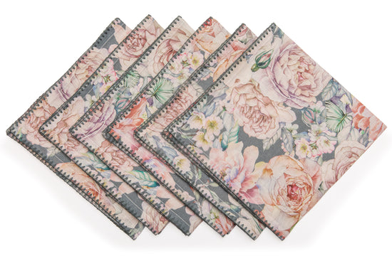 Slate green printed linen dinner napkins with delicate embroidery.