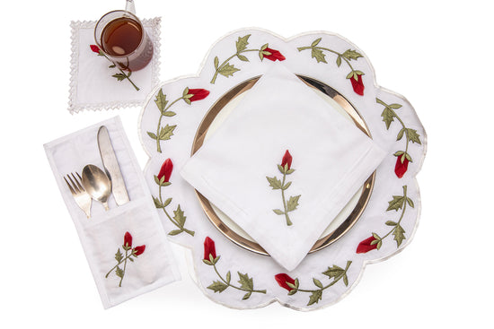 White linen cutlery holder with rosebud embroidery.