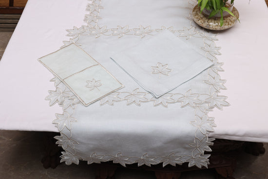 Powder blue linen silver cutwork runner.