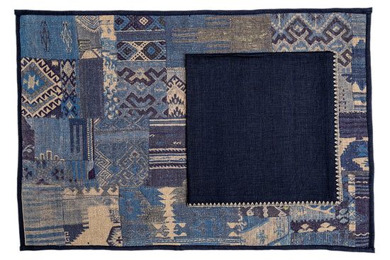 Blue printed linen placemats with embroidered linen blue napkins.