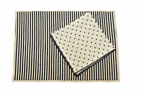 Striped linen placemats with embroidered printed linen napkins.