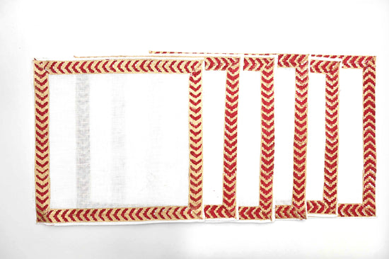 Maroon block print linen cocktail napkins.