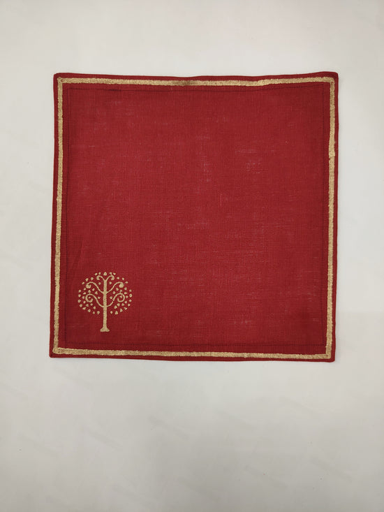 Maroon linen cocktail napkin with block print.