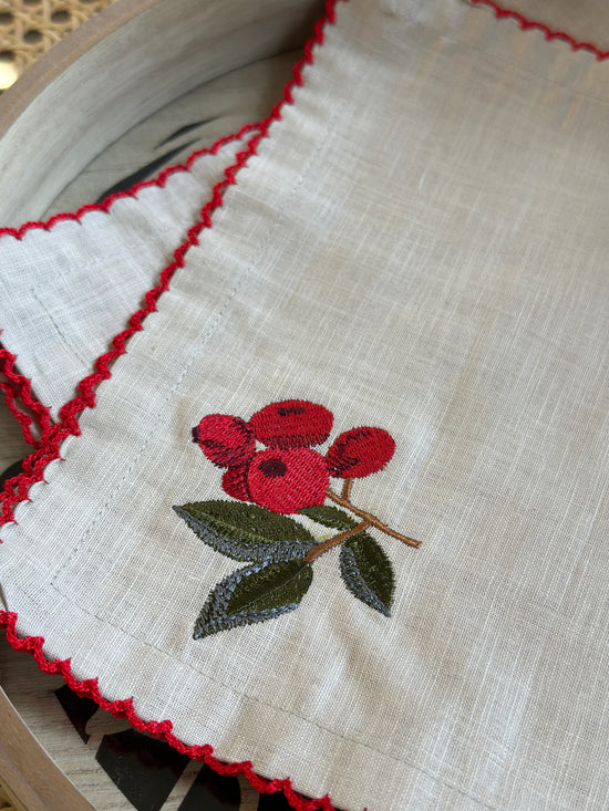 Natural linen cocktail napkins with embroidered cherries.