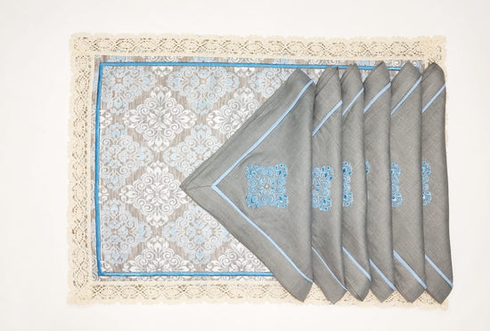Blue printed laced placemats with blue embroidered linen napkins
