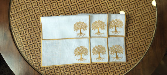 White linen cocktail napkins with tree embroidery