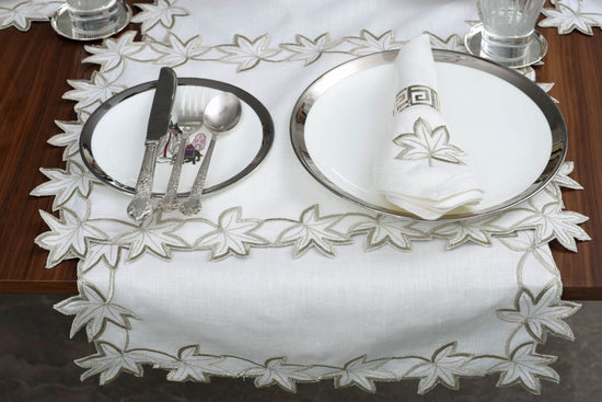 White linen runner with gold cutwork embroidery