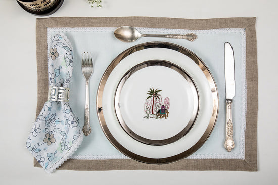 Blue linen placemats with printed linen napkins.