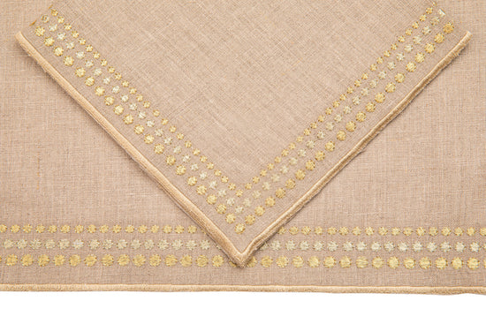 Natural linen placemats and  napkins with delicate  gold embroidery.