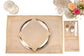 Natural linen placemats and  napkins with delicate  gold embroidery.