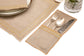 Natural linen placemats and  napkins with delicate  gold embroidery.