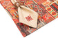 Red printed linen placemats with cream napkins.