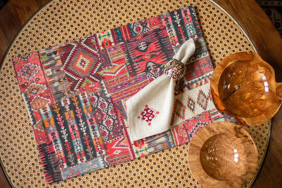 Red printed linen placemats with cream napkins.