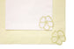 Striped linen placemats and white linen napkins with floral embroidery.