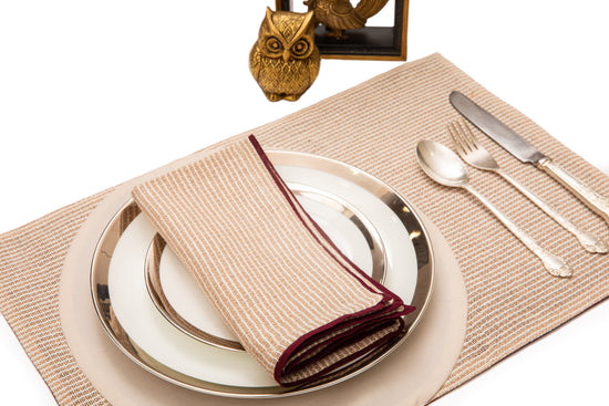 Striped linen placemats with striped linen napkins.