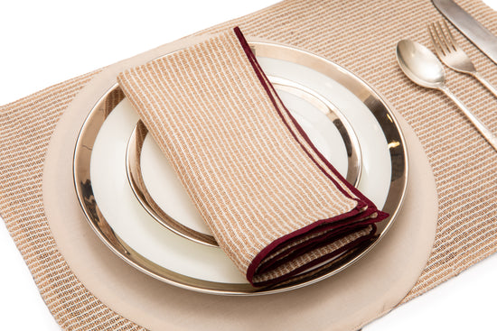 Striped linen placemats with striped linen napkins.