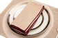 Striped linen placemats with striped linen napkins.