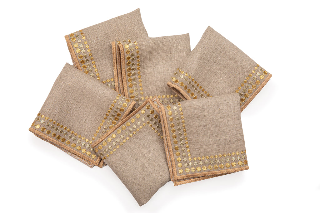 Natural linen cocktail napkins with delicate  gold embroidery.