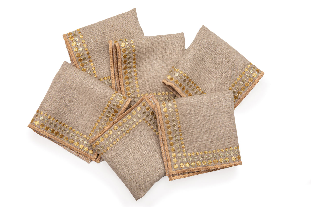 Natural linen cocktail napkins with delicate  gold embroidery.