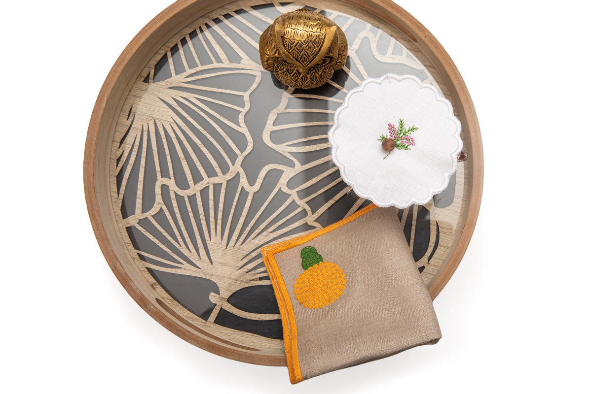 Natural linen cocktail napkins with  embroidered marigold.