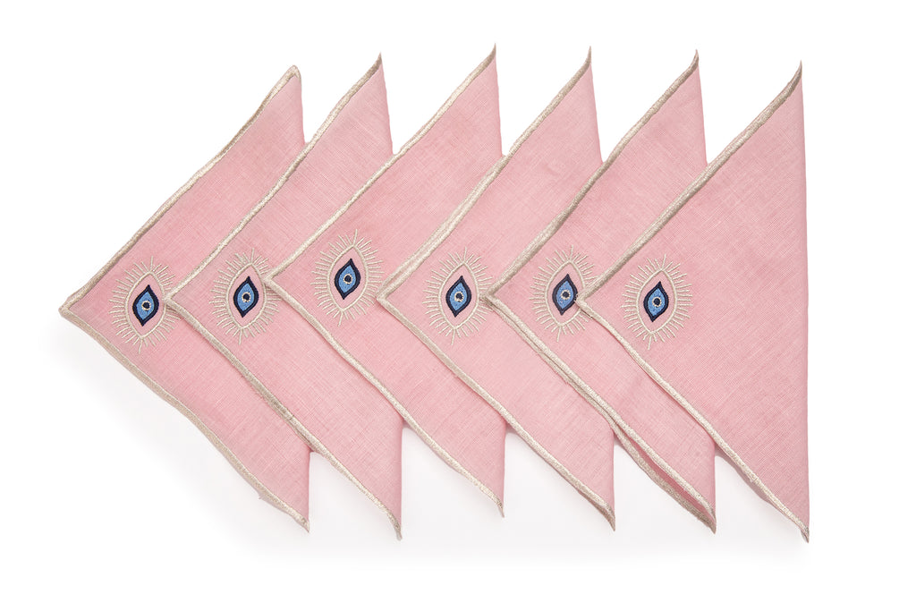 Pink linen cocktail napkins with embroidered evil eye.