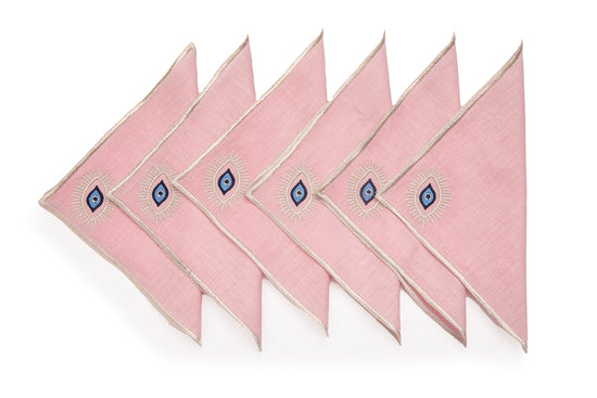 Pink linen cocktail napkins with embroidered evil eye.