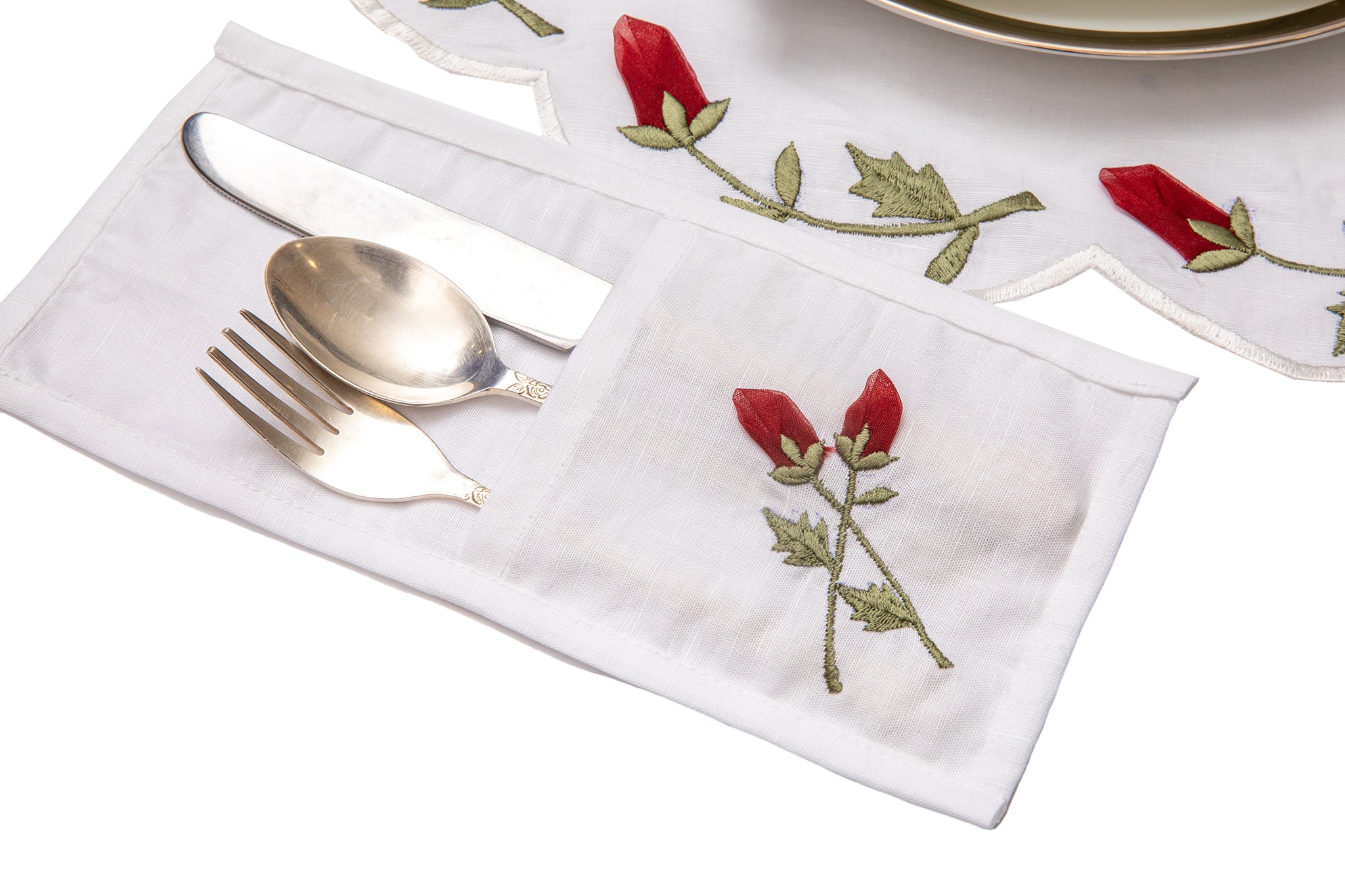 White linen cutlery holder with rosebud embroidery.
