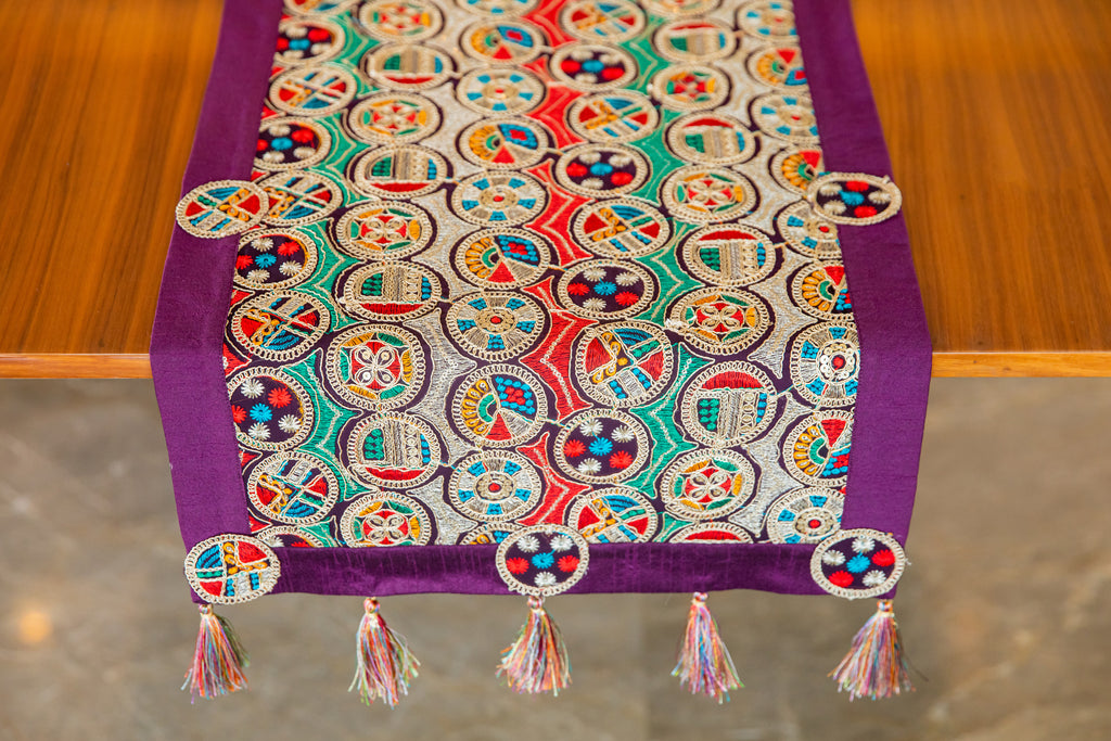 Runner with multicolor circle embroidery.
