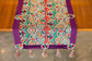 Runner with multicolor circle embroidery.