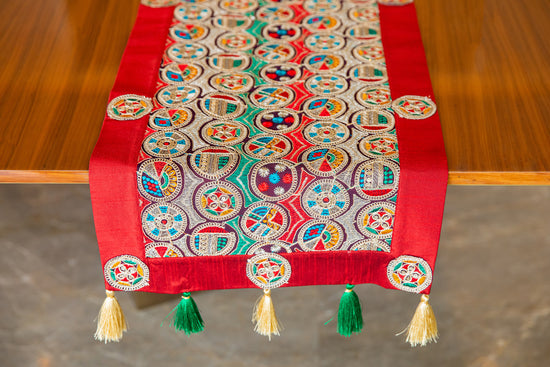Runner with multicolor circle embroidery.