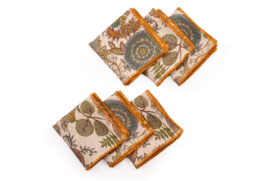 Printed linen cocktail napkin with delicate embroidery.