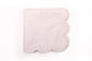 White linen scalloped and embroidered dinner napkin.