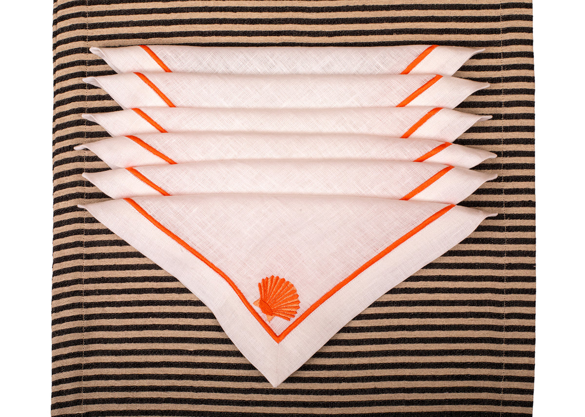 White linen embroidered cocktail napkin.
