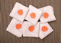 White linen embroidered cocktail napkin.