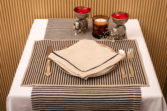 Striped linen placemat and natural linen embroidered napkin.