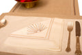 Cream linen placemat with  cream linen embroidered napkin.
