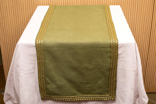 Olive green linen runner with gold embroidery.