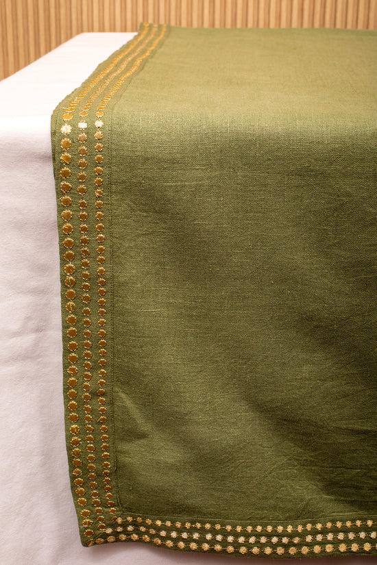 Olive green linen runner with gold embroidery.