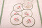 White linen embroidered  coaster with mint green floral detailing.