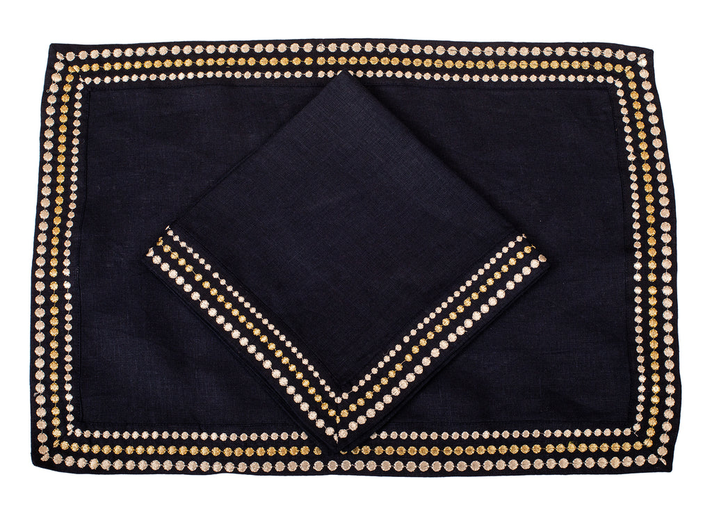 Navy blue linen placemat and  napkin with silver embroidery.