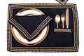 Navy blue linen placemat and  napkin with silver embroidery.