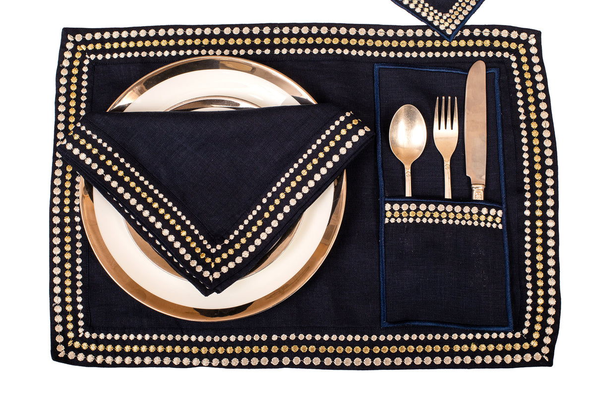 Navy blue linen placemat and  napkin with silver embroidery.