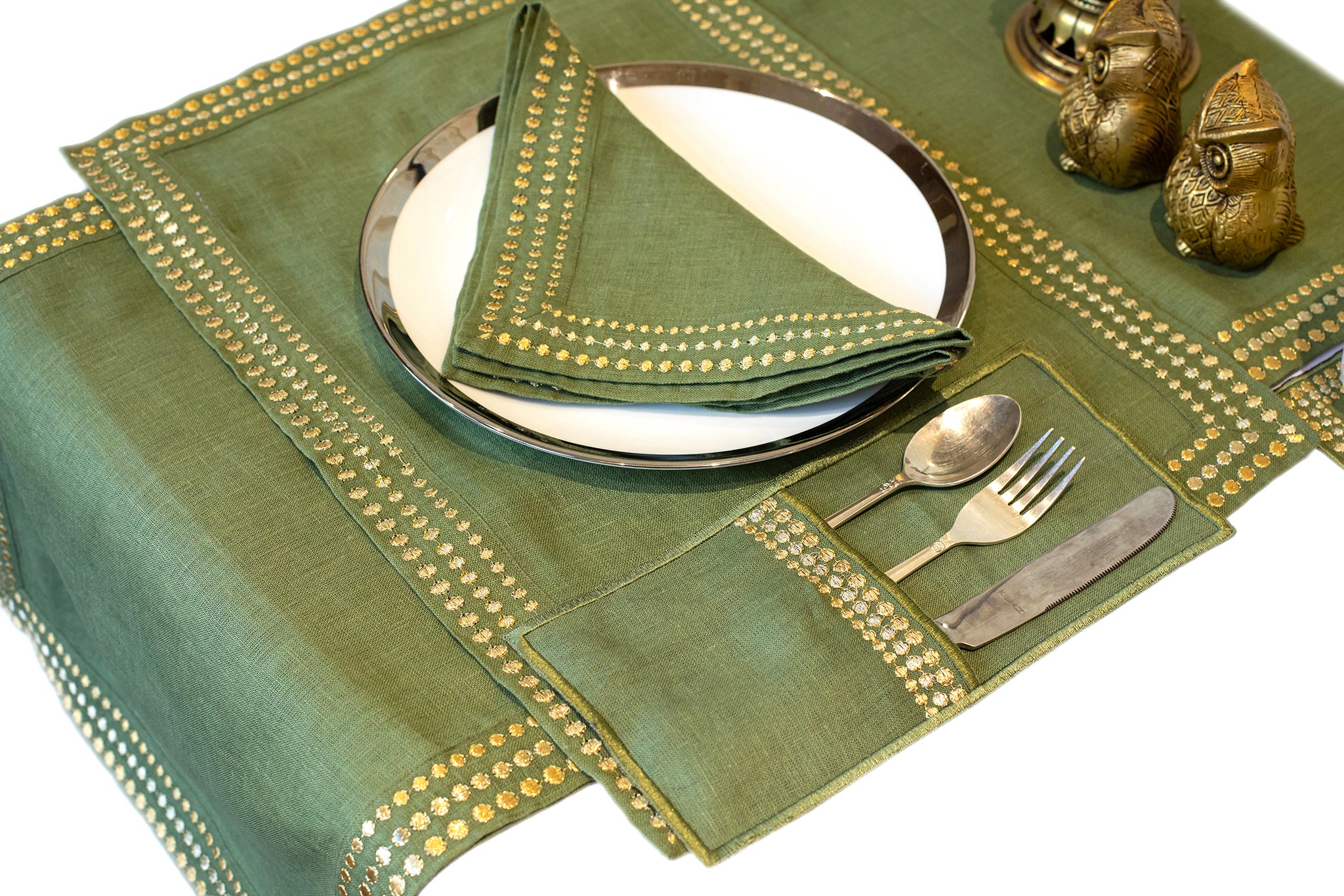 Olive green linen cutlery holder with delicate embroidery.