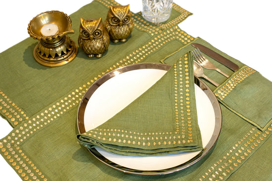 Olive green linen coaster with delicate embroidery.