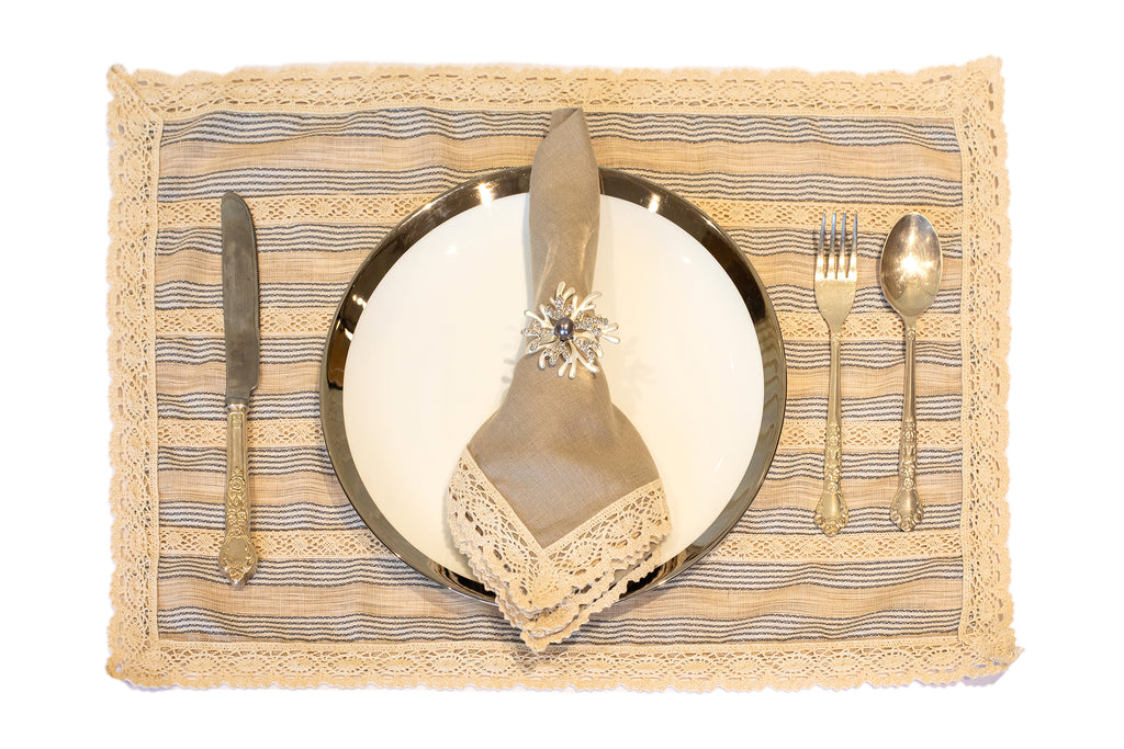 Blue and beige striped linen placemat and napkin with lace detailing.