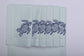 Powder blue linen placemats and napkins with embroidered turtle.