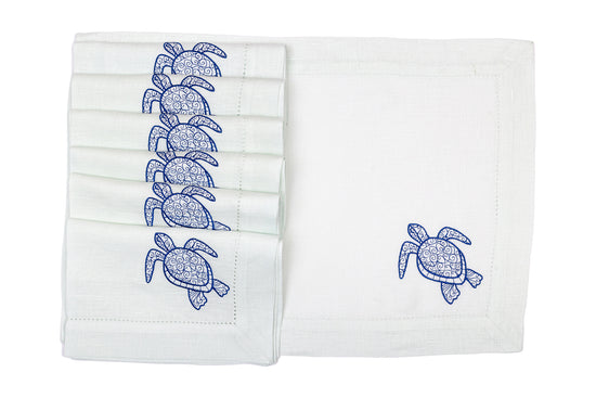 Powder blue linen placemats and napkins with embroidered turtle.