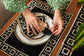 Black linen embroidered placemat and napkin.